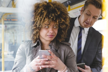 JanetMNast.Man looking over woman's shoulder